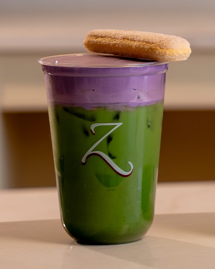 Ube Tiramisu Matcha topped with a ladyfinger