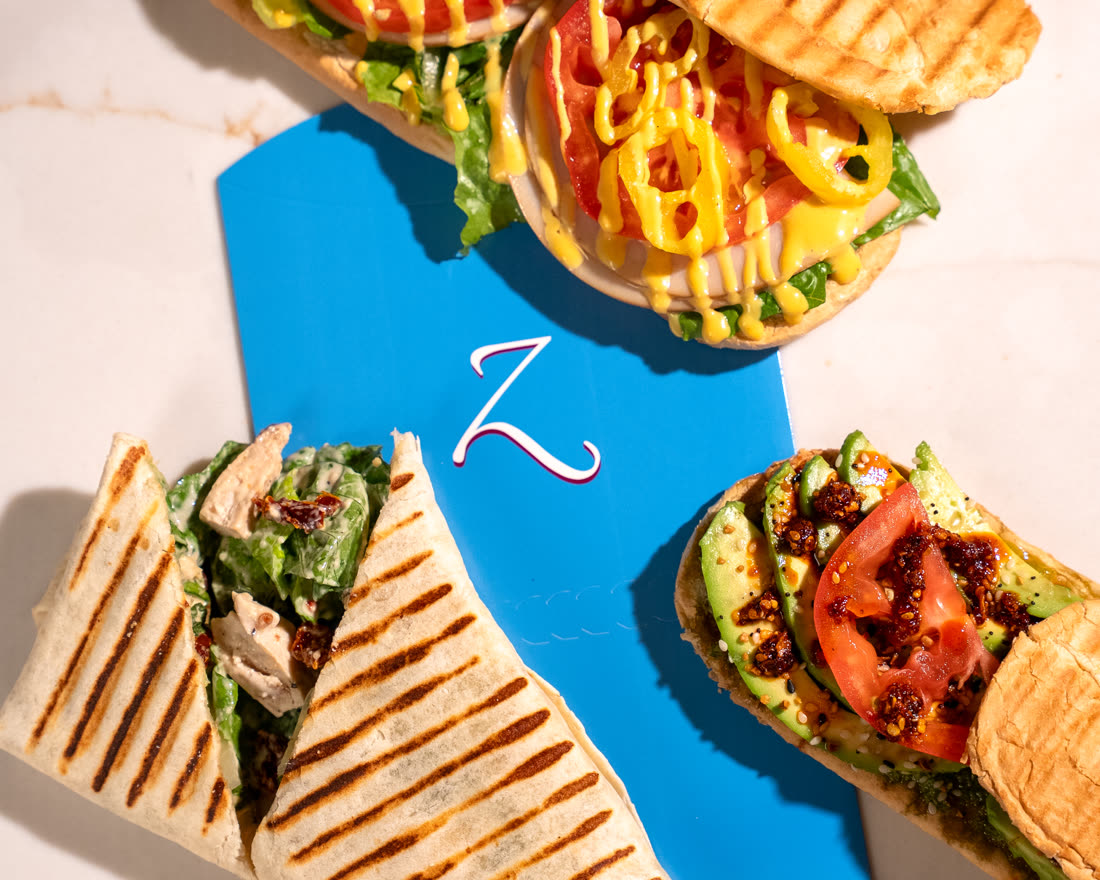 Huncho's Turkey panini, Hesh's Caesar wrap and Feedo's Avocado panini together