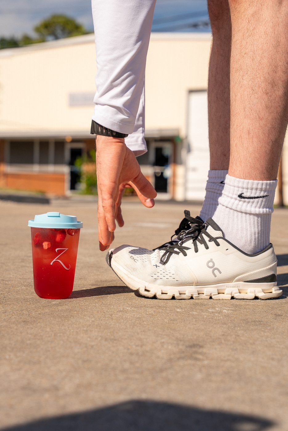 Z Burgundy refresher in a branded cup, athletic lifestyle