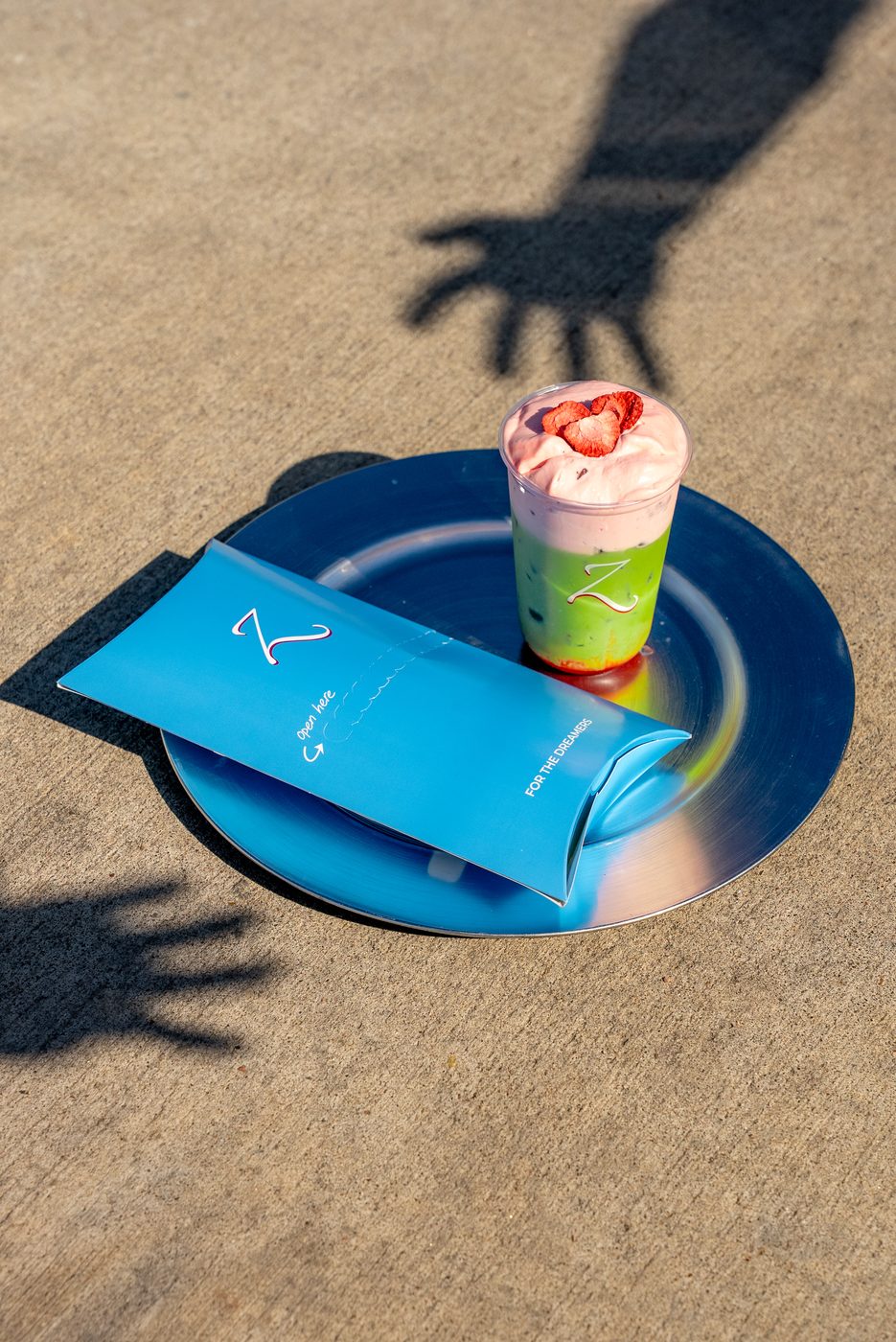 Strawberry cream matcha on a branded blue Z plate